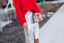 an oversized red chunky sweater, a silver sequin midi skirt with a slit, a grey bag and nude heels plus statement earrings