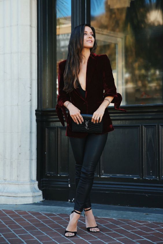 black leather skinnies, a burgundy velvet blazer with tied up sleeves, a black clutch and black shoes for Christmas