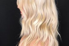 fantastic shiny wavy blonde hair of medium length is right what you need to try, as such a shade flatters most of complexions