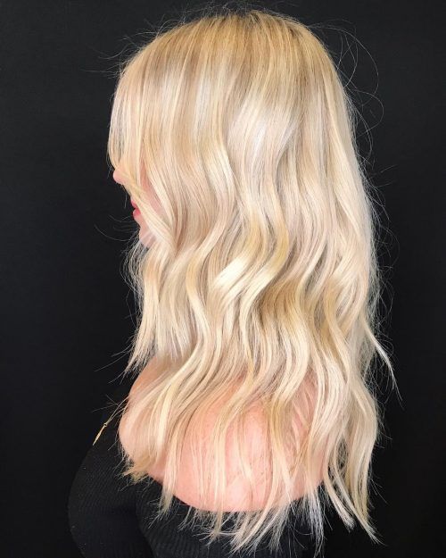 fantastic shiny wavy blonde hair of medium length is right what you need to try, as such a shade flatters most of complexions