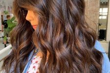 long and wavy cold brew hair with a bit of shiny chestnut and rich brown touches for dimension and more interest