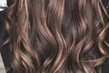 long and wavy cold brew hair with chestnut, light brunette and honey balayage starting in the middle looks gorgeous