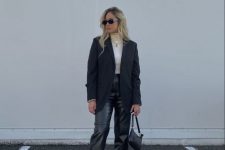 simple monochrome – a neutral turtleneck, black leather trousers, black chunky boots, a black blazer and a small bag
