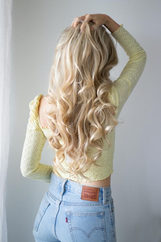 super long curly creamy blonde hair is classics that is all about femininity and delicate and girlish looks