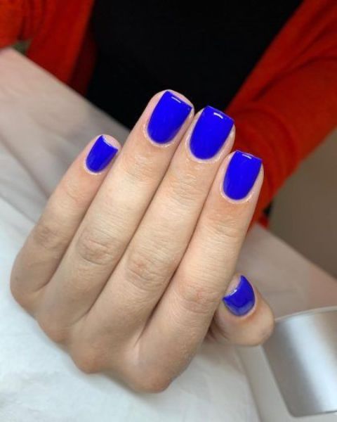gorgeous bright blue nails of a square shape are a super trendy and edgy solution for a bold look