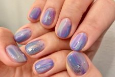 25 brushstroke Very Peri and blush nails with stars and glitter for a slight celestial feel are a dreamy idea