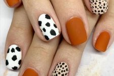 39 a colorful manicure with rust nails and bold animal-printed ones is a cool bold idea for the fall