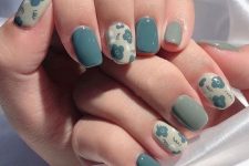 40 mismatching green and blue nails of muted shades, with floral print accents are amazing