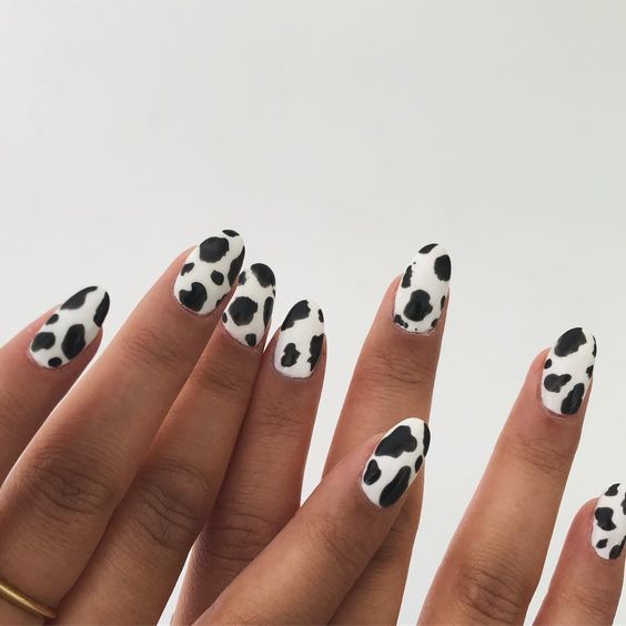 cow print manicure in black and white is a super fun and cheerful idea to try this year