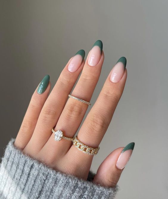 a French manicure with green tips and a green accent nail is a lovely idea for fall