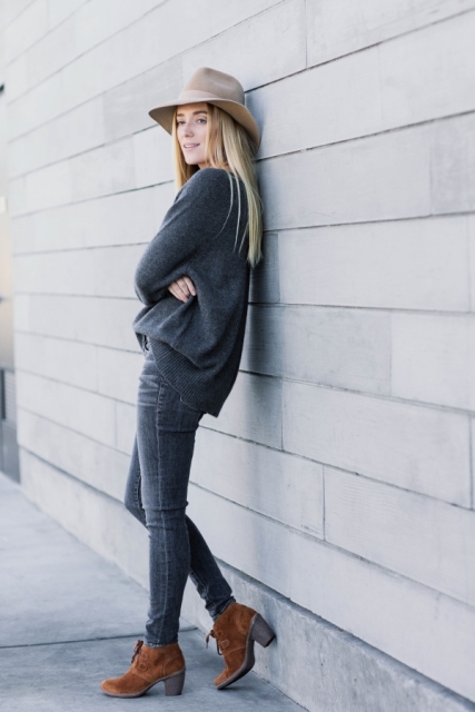 With dark gray loose sweater, skinny jeans and brown suede lace up ankle boots