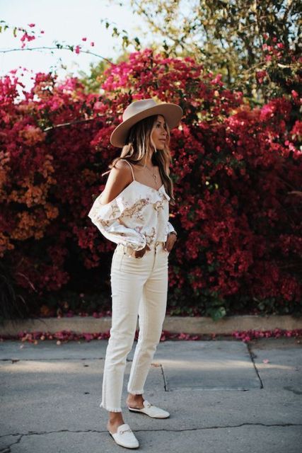 With floral printed off the shoulder ruffled blouse, beige cropped pants and white leather flat mules