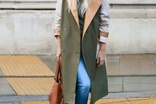 With gray turtleneck, blue cuffed jeans, brown leather tote bag and beige lace up flat ankle boots