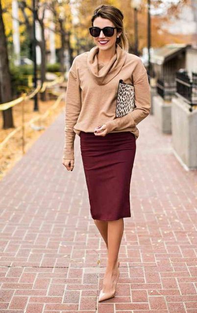 With leopard printed clutch, marsala knee-length skirt, beige leather pumps and oversized sunglasses