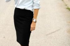With light blue denim button down shirt, golden bracelet and black knee-length skirt