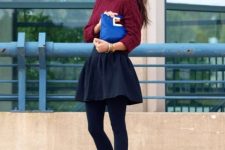 With marsala turtleneck sweater, navy blue skater mini skirt, sunglasses, cobalt blue leather clutch and dark gray tights