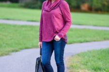 With purple cowl neck loose shirt, navy blue jeans and black leather backpack
