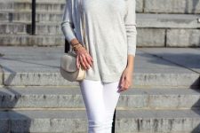 With sunglasses, white skinny pants, gray suede ankle boots and beige chain strap mini bag