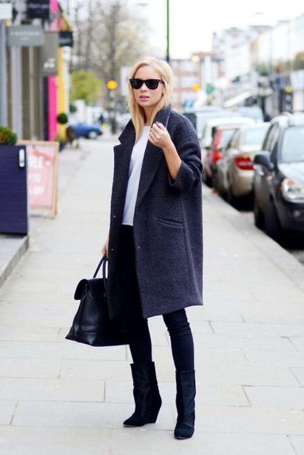 With white shirt, sunglasses, black skinny pants, black leather tote bag and dark colored knee-length coat