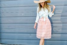 With white top, light blue button down shirt, pale pink knee-length skirt and beige ankle strap high heels