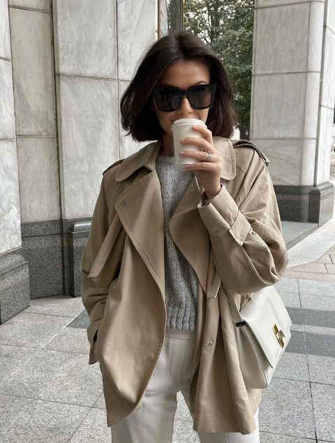 a grey cropped sweater, creamy pants, a tan cropped trench and a white bag for the transitional time