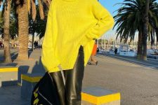 a neon yellow sweater, black leather pants, neon yellow trainers and black socks plus a black backpack