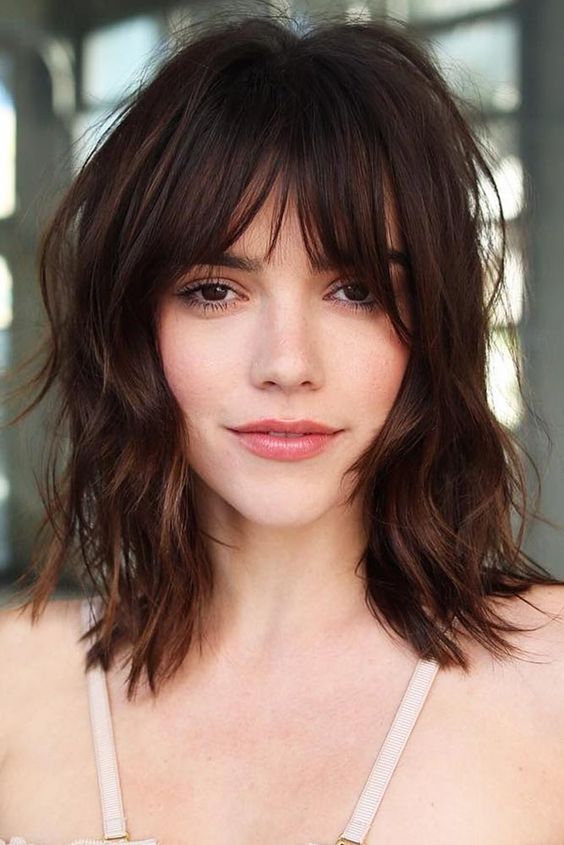 a pretty dark brown shaggy lob with layered bangs is a beautiful and messy idea that looks effortlessly chic