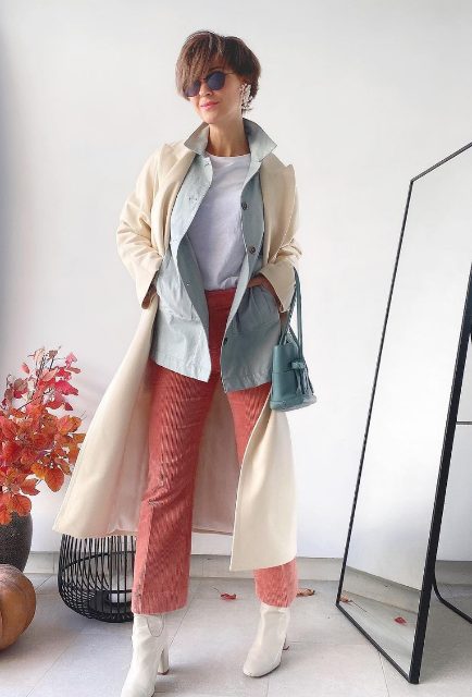 a pretty muted color look with a white te, a light blue jacket, coral pants, white boots and a white coat plus a blue bag
