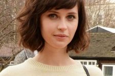 a short dark brown bob with slight waves and side bangs is a beautiful and timeless idea