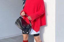 a white shirt, a hot red asymmetrical sweater, black biker shorts, red bots and a black bag