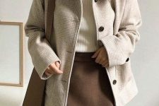 a wihte ribbed turtleneck, a brown mini skirt, a neutral printed cropped coat and a taupe bag