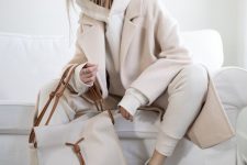an all-neutral look with a creamy hoodie and sweatpants, a creamy coat and a bag with tassels for every day