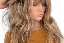 beautiful long honey blonde hair with layered bangs and waves is a very romantic and very girlish idea