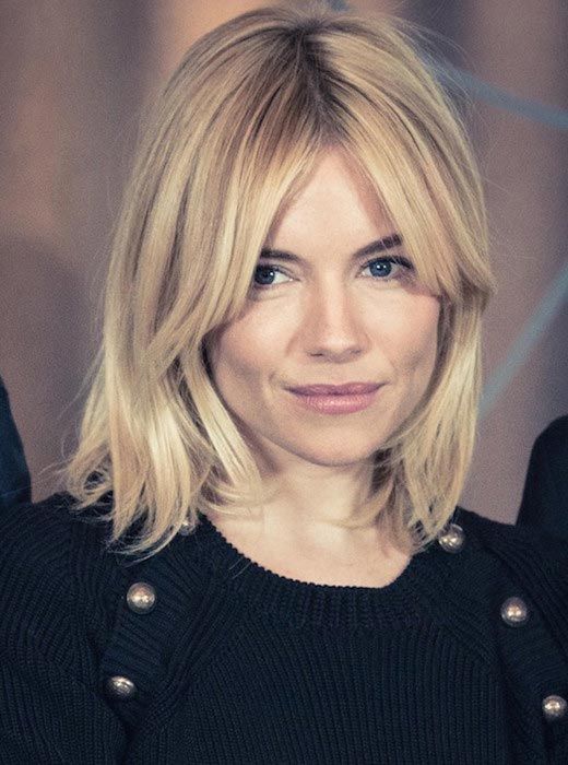 beautiful medium length blonde hair with bottleneck bangs and a bit of texture is a fresh modern idea to try