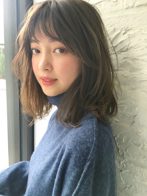 brown medium length hair with texture and layered bangs looks cute, elegant and pretty timeless