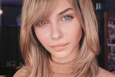 delicate honey blonde medium length hair with side bangs is a gorgeous idea that never goes out of style