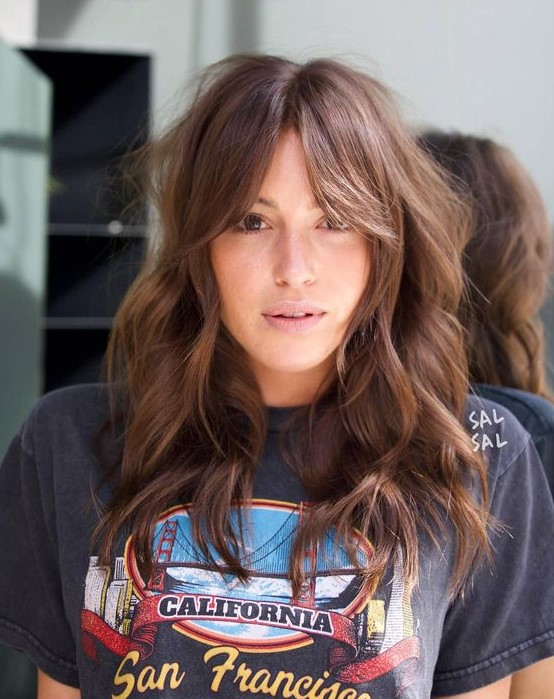 fab brunette hair with bottleneck bangs and waves plus a messy touch is amazing to rock any time