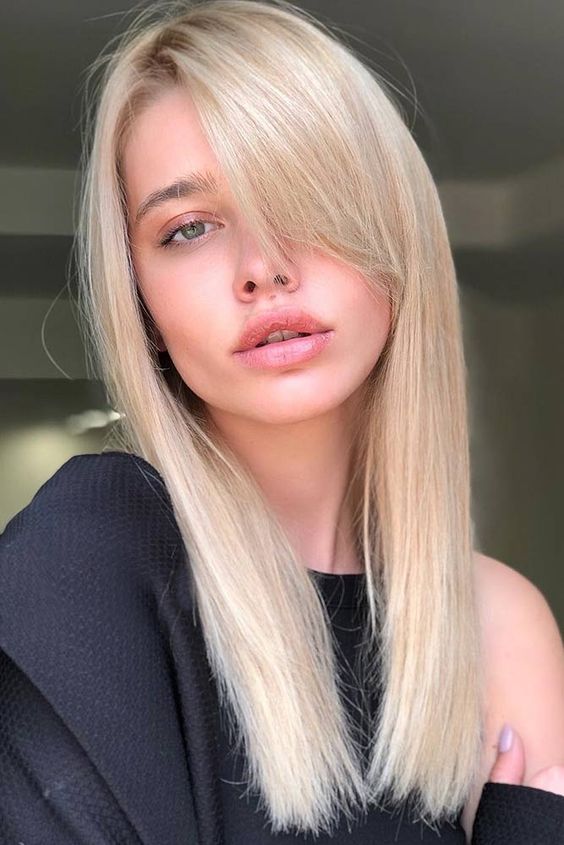 long delicately blonde sleek hair with side bangs is a classic idea that always works