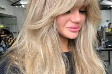 naturally blonde long hair with balayage and much volume, with layered bangs and lowlights is amazing