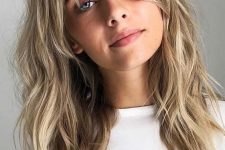 06 beautiful shaggy shoulder-length hair with icy blonde balayage and bottleneck bangs for more softness and cuteness in the look