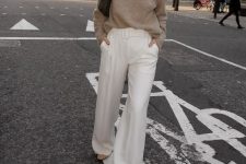 11 a simple and cool outfit with a grey turtleneck sweater, creamy high waisted trousers, grey boots and a small black bag