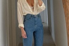 12 a sexy outfit with blue high waisted jeans, tan boots, a lovely bralette and a white shirt on
