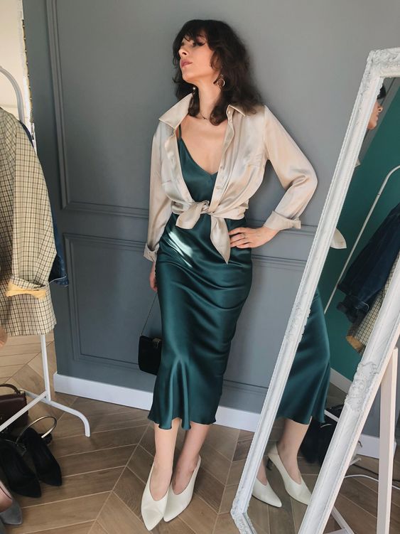 a beautiful green midi slip dress, white shoes, a mother of pearl shirt and a black bag