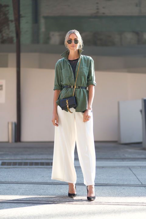 a chic and simple brunch look with a black striped top, an olive green belted shirt, a black bag, white wideleg trousers and black shoes