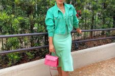 19 a pastel green slip midi dress, a bold green cropped denim jacket, white sneakers and a pink mini bag for a spring brunch