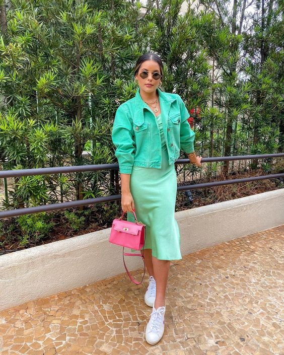 a pastel green slip midi dress, a bold green cropped denim jacket, white sneakers and a pink mini bag for a spring brunch