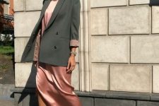 20 a pink midi dress, a green overiszed blazer, pink shoes with pompoms for a cute look