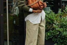 24 a lovely brunch look with a white shirt, a green jumper, light green pants, zebra print slingbacks and a brown clutch