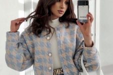 25 a preppy look with a white turtleneck, blue high waisted jeans, a pastel tweed cropped jacket with pearl buttons and a white bag