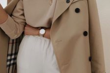 31 a tan long sleeve top, white sweatpants, a classic tan Burberry trench for a comfy and cozy spring look